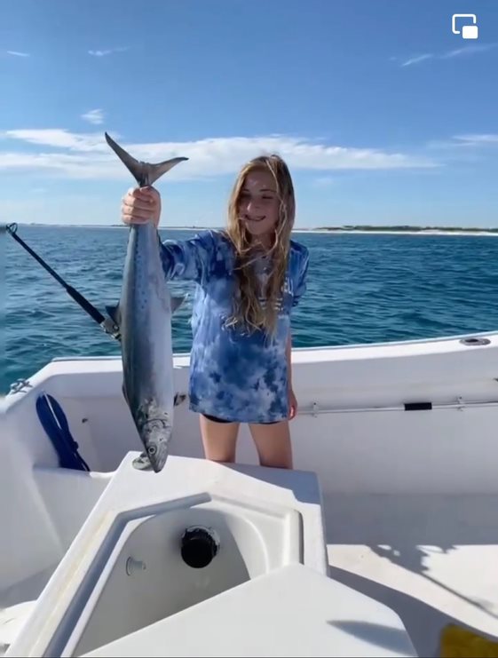 me holding a fish